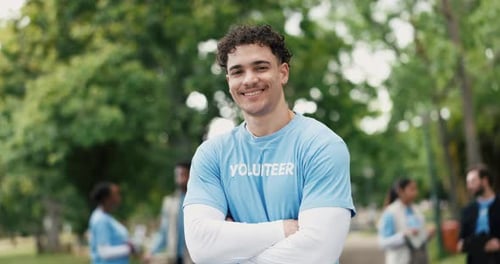Face, volunteer or man in park with arms crossed for eco project, outreach or nonprofit service