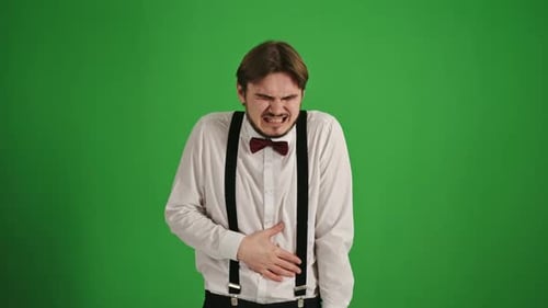 Disgusted Young Man Feeling Nauseous on Green Screen