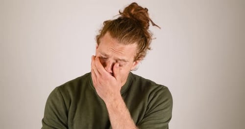 Male being very sad and crying.