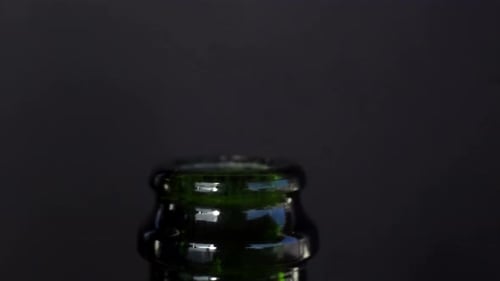 Foam Erupting From Green Bottle After Cork Popped