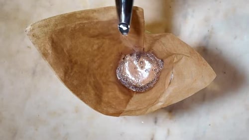 Pouring Water Through Coffee Filter Close Up