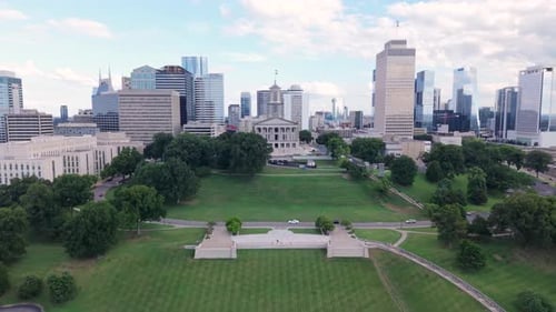 Downtown Nashville, Tennessee and capitol building, city skyline, and Snow Sled Hill - rising drone