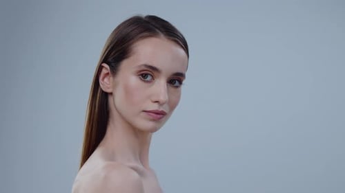 Young Woman Portrait on Plain Background