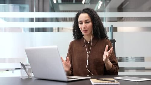 Professional Woman on Video Conference Call in Office