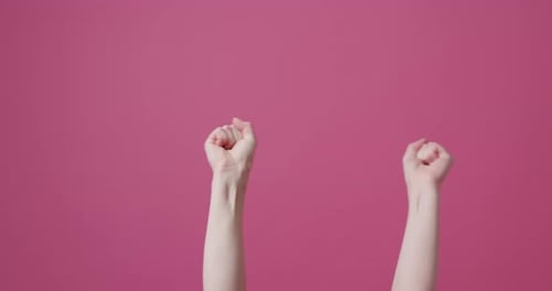 Hands and Arms Gesturing on a Pink Background