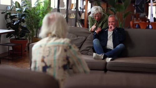 Three Seniors Conversing in Cozy Living Room