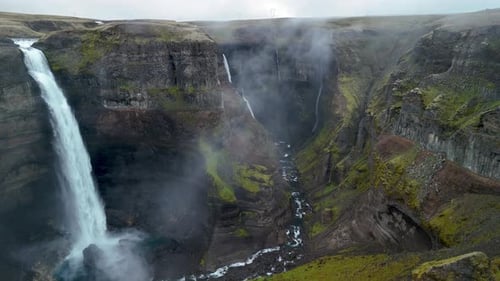 Aerial View of Waterfalls in Scenic Canyon
