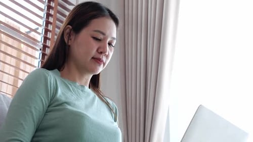 Woman Working on Laptop Computer From Home