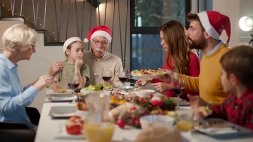 Big Dinner Party with a Crowd of Multiethnic Diverse Friends Celebrating at a Restaurant