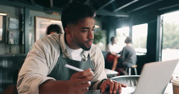 Typing, serious and man with laptop, coffee shop and online for profit ...