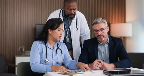 Doctors, team and discussion in boardroom with documents, budget and meeting at hospital