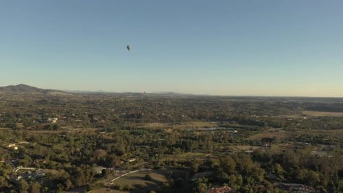 Hot air balloon flying over Rancho Santa Fe, San Diego County.