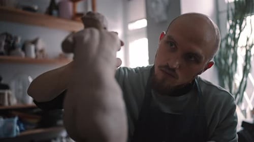 Closeup Concentrated Caucasian Man Talented Sculptor Working on Clay Statue in His Workshop