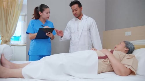 Specialist doctor man and nurse explaining and check with elderly patient in hospital.