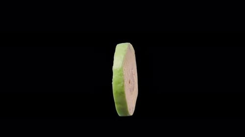 Slice of Guava Spinning on Black Background