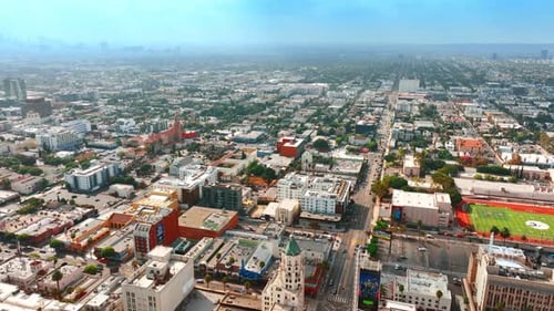 Flying above the urban cityscape at daytime. Scenery of Los Angeles, California, USA