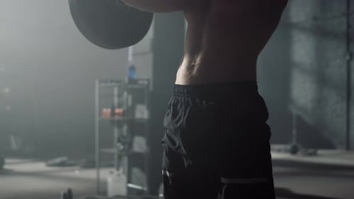 Fit Man Doing Front Squat with Barbell During Fitness Workout in Gym