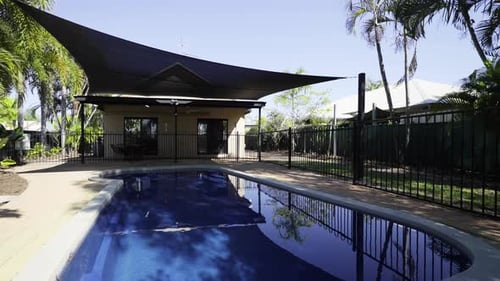 Swimming pool with shade sail