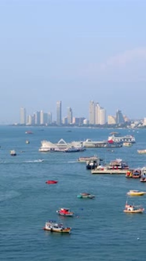 Pattaya cityscape vertical time lapse video from a viewpoint on a hill. Pattaya city, Thailand.