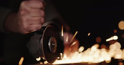 Angle Grinder Sparks in Moody Dark Setting