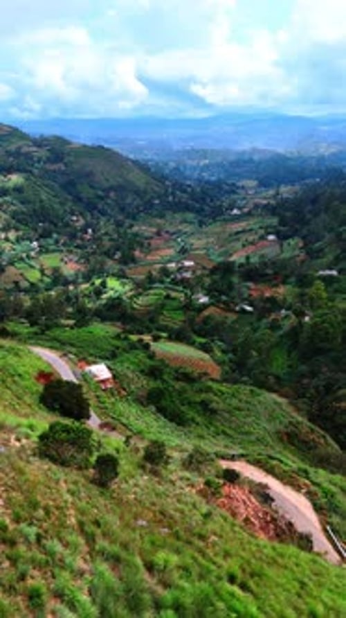 Stunning view of a picturesque village locating in the valley among the green mountains.