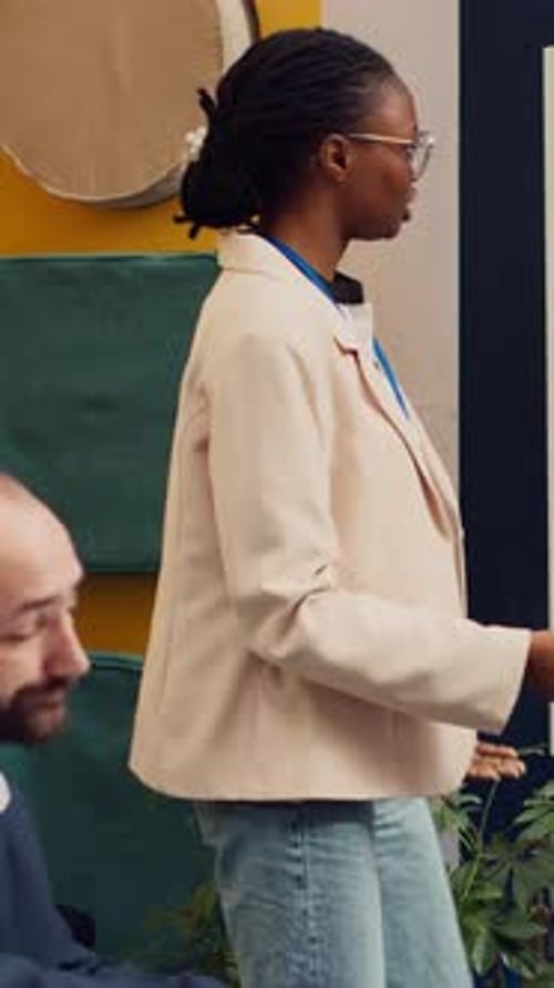 Woman Giving Presentation in Modern Office Workplace