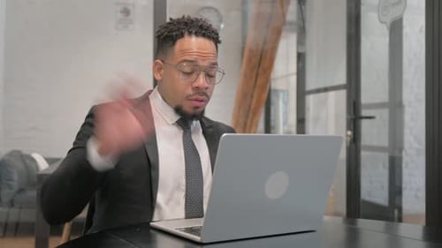 Man in Suit on Laptop Video Conference