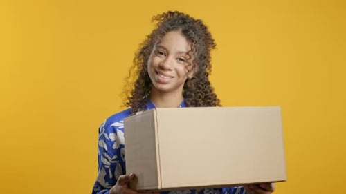 Excited Smiling African American Teenager Girl Online Shopping Consumer Received Cardboard Order