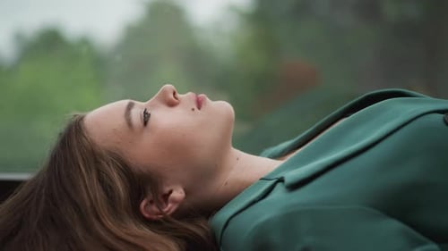 Woman Relaxing Near the Window