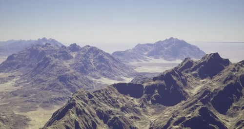 Majestic Mountain Landscape Under Clear Blue Sky at Midday