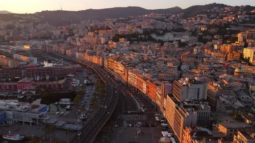 Genoa's historical center at sunset, showcasing the vibrant cityscape and streets, aerial view