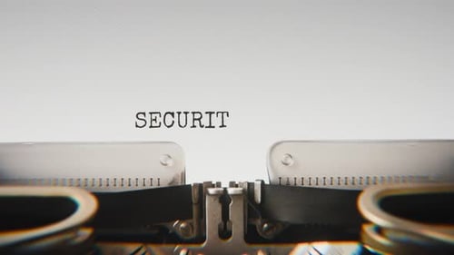 Old mechanical typewriter typing Security Clearance in a close-up view.