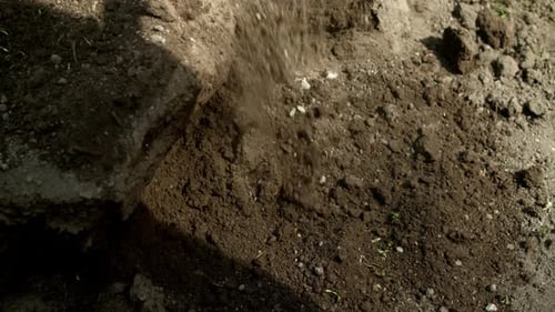 Shovel Digging Into Soil On Sunny Day