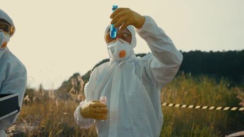 Scientists in Hazmat Suits Testing Sample