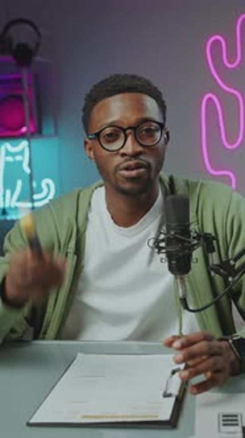 Gen Z African American Man Filming Vlog at Home Recording Studio