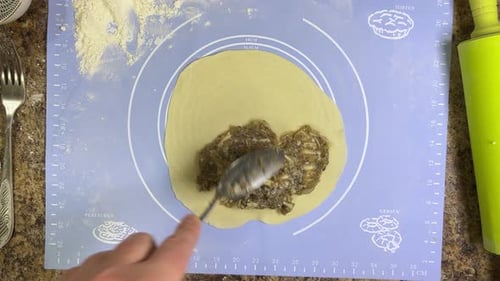 Preparing patties with ground beef and the process of forming a patty from raw dough. Top view.