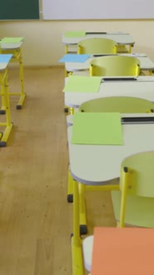 An Empty Classroom with Colorful Desks and Chairs a Bright and Spacious Interior Perfect for