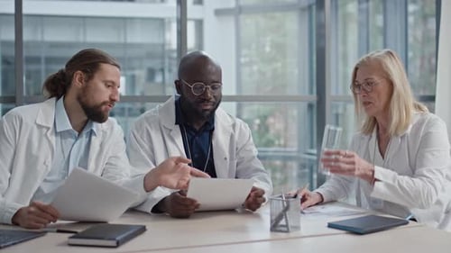 Head of Clinic and Employees Having Annual Meeting at Boardroom