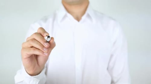 Man Writing International Word on Clear Surface