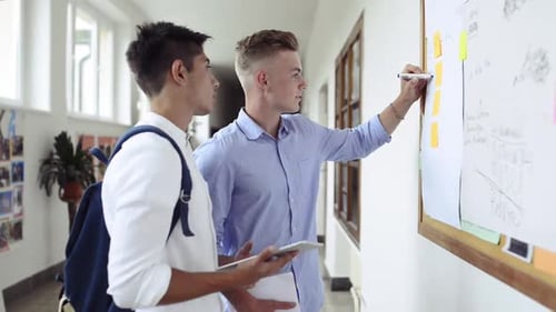 Teenage Students In High School Hall.