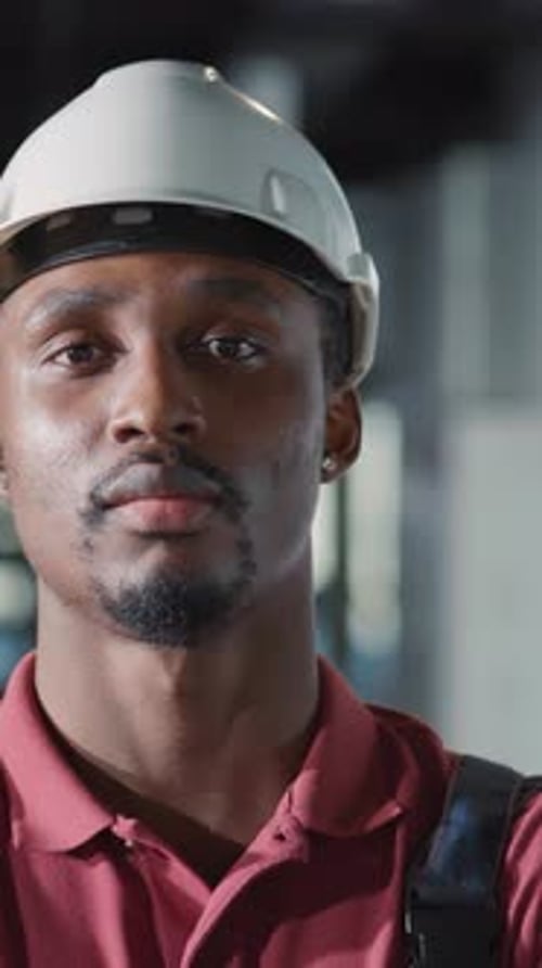 A Dedicated Construction Worker is Seen Wearing a Safety Helmet to Ensure Their Safety