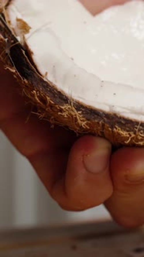 Cutting coconut meat with a knife