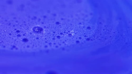 Viscous Blue Liquid with Bubbles Macro Shot
