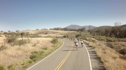 Drone captures bike race adventure on open road through sunny San Diego California