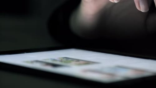 Fingers Swiping on Touchscreen of Digital Tablet