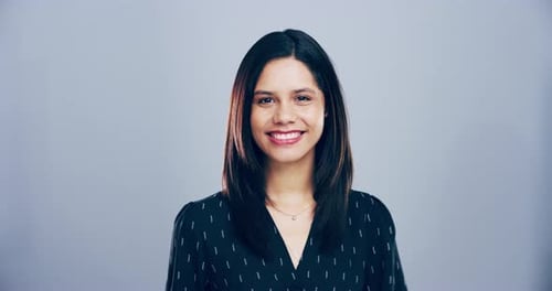 Smiling Woman Makes Heart Shape With Her Hands