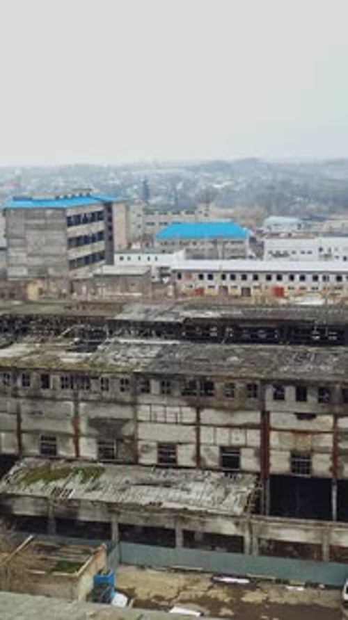 Flight over the destroyed factory. Old industrial building for demolition. Aerial view
