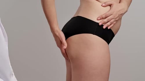 Healthcare Professional Examining an Adult Woman's Body