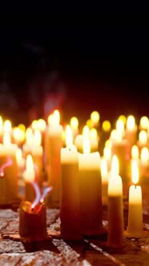 Flickering Candle Extinguishes in Dark Ambiance