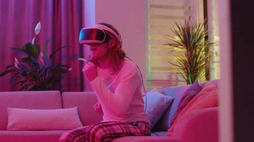 Man Playing Video Game with VR Headset At Home